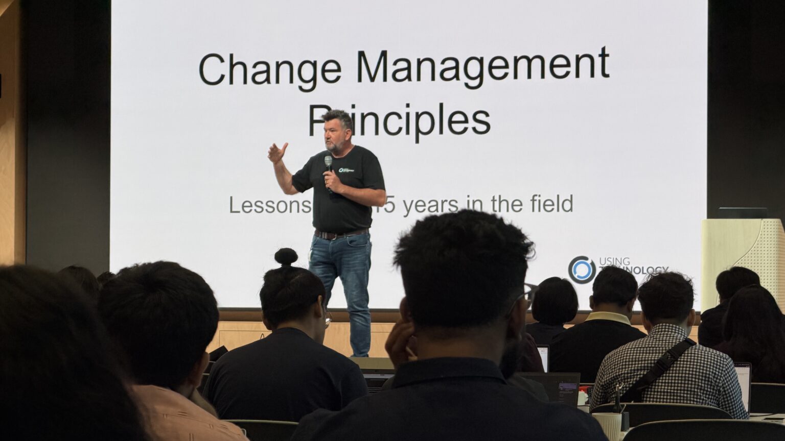 Mike Reading speaking at a conference