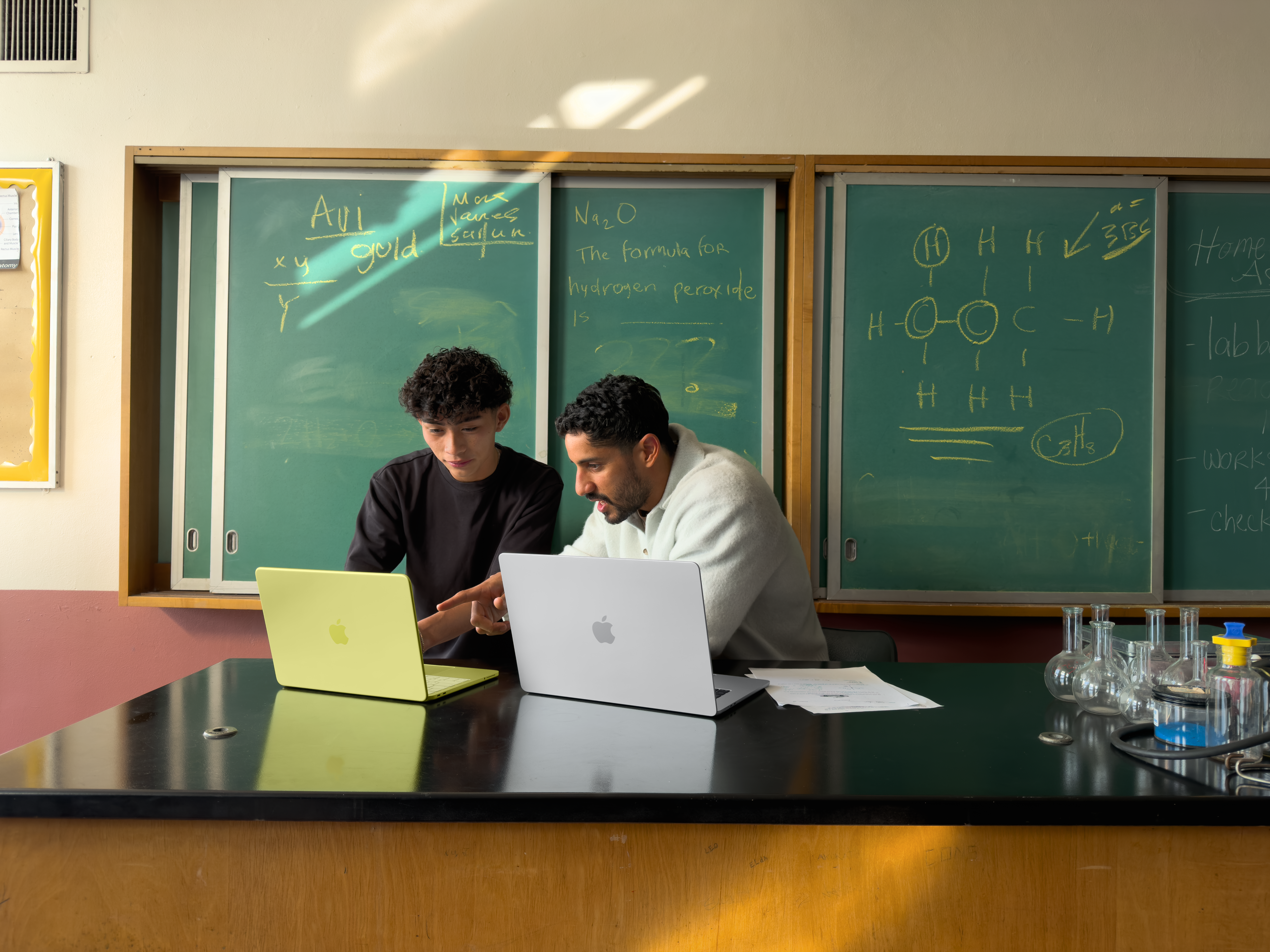 Teacher working on a MacBook
